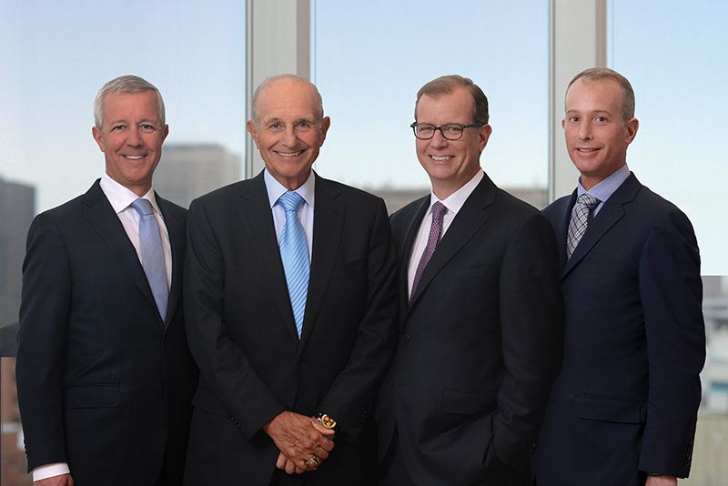 Four members of the Jacobs family standing next to each other.