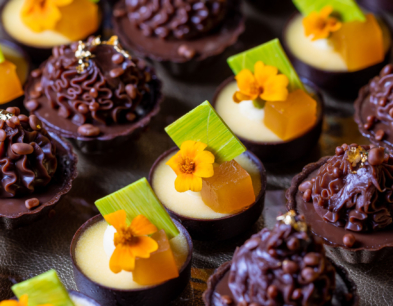 A close up of rows of small desserts from Emmy's.