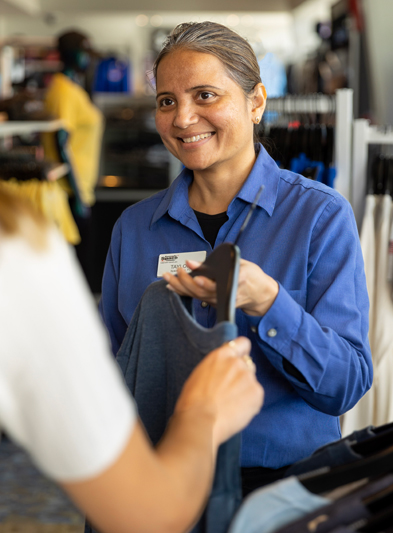 A retail associate helping a guest