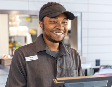 A smiling cashier