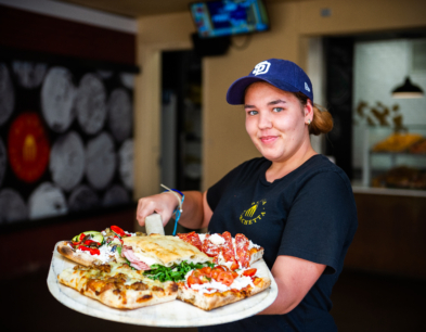 Smiling guest serving guest at Petco Park